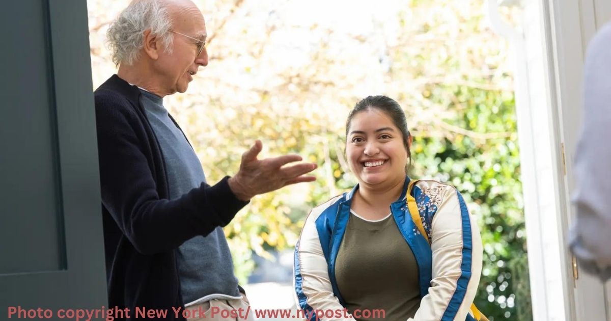 Keyla Monterroso Mejia in a light mood with a smile. she is wearing a olive green and white tshirt